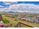 Breathtaking view from the backyard overlooking the community and distant mountains at 13325 W 86Th Dr, Arvada, CO 80005