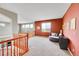 Sitting area located upstairs with an accent wall and a scenic view of the outside area at 13325 W 86Th Dr, Arvada, CO 80005