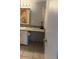 Bathroom with granite countertop and decorative mirror at 7495 E Quincy Ave # 205, Denver, CO 80237