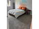 Cozy bedroom with a bed, shelving unit, and unique headboard mural at 7495 E Quincy Ave # 205, Denver, CO 80237