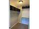 Walk-in closet with storage shelves and clothing rods for organization at 7495 E Quincy Ave # 205, Denver, CO 80237