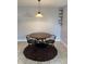 Dining room featuring a modern table, chairs, and light fixture at 7495 E Quincy Ave # 205, Denver, CO 80237