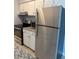 Updated kitchen showcasing stainless steel appliances and ample counter space at 7495 E Quincy Ave # 205, Denver, CO 80237