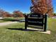 Rosamond Park entrance sign surrounded by vibrant fall foliage, inviting residents to enjoy outdoor recreation and scenic beauty at 7495 E Quincy Ave # 205, Denver, CO 80237