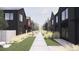 Street view showing the architecture of modern townhomes with clean lines and inviting landscaping at 783 E County Line Rd, Erie, CO 80516