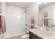 This bathroom includes a shower and tub combo and a modern vanity at 3449 W 63Rd Pl, Denver, CO 80221