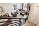 An open concept living room includes a comfortable gray sofa and modern decor at 3449 W 63Rd Pl, Denver, CO 80221