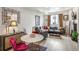 Open concept living room with stylish furniture, a decorative mirror, and modern decor at 3449 W 63Rd Pl, Denver, CO 80221