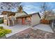 Backyard featuring a small brick patio and stair access to a covered deck at 12642 E Ohio Ave, Aurora, CO 80012