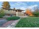 Backyard featuring a well-maintained lawn and a covered patio at 12642 E Ohio Ave, Aurora, CO 80012