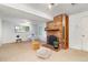 A finished basement with a brick fireplace, contemporary furniture, and warm lighting, perfect for relaxing at 12642 E Ohio Ave, Aurora, CO 80012