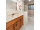 Bathroom featuring a custom wood vanity with drawers and a marble countertop at 12642 E Ohio Ave, Aurora, CO 80012