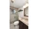Bathroom featuring a glass shower, stylish vanity, and modern fixtures at 12642 E Ohio Ave, Aurora, CO 80012