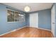 A clean and bright bedroom with new paint and laminate flooring at 12642 E Ohio Ave, Aurora, CO 80012