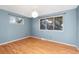 Bedroom with laminate flooring and windows offering natural light and views at 12642 E Ohio Ave, Aurora, CO 80012