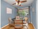 Cozy dining area with a ceiling fan and sliding glass doors leading to the balcony at 12642 E Ohio Ave, Aurora, CO 80012
