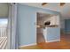 A view from the dining room towards the kitchen showcasing an open transition and modern design at 12642 E Ohio Ave, Aurora, CO 80012
