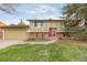 Charming two-story home with red brick and a well-maintained front yard at 12642 E Ohio Ave, Aurora, CO 80012