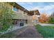 Exterior view of a multi-level home with a covered deck at 12642 E Ohio Ave, Aurora, CO 80012