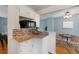 Bright kitchen nook featuring white cabinets, granite countertops, and stainless steel appliances at 12642 E Ohio Ave, Aurora, CO 80012