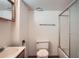 This bathroom features a shower with glass doors, standard toilet, and wooden vanity at 9202 W Ontario Dr, Littleton, CO 80128