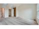 Large bedroom features plush carpet, ample natural light, and access to en-suite bathroom at 9202 W Ontario Dr, Littleton, CO 80128