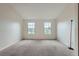 Spacious bedroom features neutral carpet, fresh paint and bright windows at 9202 W Ontario Dr, Littleton, CO 80128