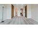 Bright bedroom with neutral carpet and two closets provides ample storage at 9202 W Ontario Dr, Littleton, CO 80128