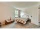 This comfortable bedroom features carpet and lots of natural light at 9202 W Ontario Dr, Littleton, CO 80128