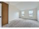 Bedroom with a vaulted ceiling and plush neutral carpeting provides comfort and style at 9202 W Ontario Dr, Littleton, CO 80128