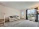 Inviting living room with plush carpet, a comfortable couch, and natural light at 9202 W Ontario Dr, Littleton, CO 80128