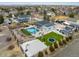 Expansive aerial view of a home featuring a large pool, sports court, and manicured landscaping at 14712 Kalamath Ct, Westminster, CO 80023
