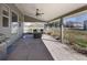 Covered back patio with a ceiling fan, outdoor furniture, and a grill, perfect for outdoor living at 14712 Kalamath Ct, Westminster, CO 80023