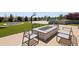 Entertainers backyard featuring a fire pit, trampoline, basketball court, and artificial turf at 14712 Kalamath Ct, Westminster, CO 80023