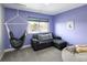 Cozy bedroom features a hanging chair, comfortable sofa, and a large window, perfect for relaxation at 14712 Kalamath Ct, Westminster, CO 80023