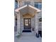 Close up of the front door with pillars and covered entryway at 14712 Kalamath Ct, Westminster, CO 80023