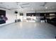 Well-organized garage with epoxy floors, ample storage, and blacked-out detailing with peg boards for tools at 14712 Kalamath Ct, Westminster, CO 80023