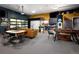 Garage space featuring a lounge area, foosball table, golf simulator, and small kitchenette at 14712 Kalamath Ct, Westminster, CO 80023