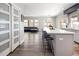 Spacious open-concept kitchen featuring an island and seamless flow to living and dining spaces at 14712 Kalamath Ct, Westminster, CO 80023