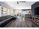 Open-concept living area featuring a comfortable couch, dining area, and modern kitchen at 14712 Kalamath Ct, Westminster, CO 80023