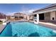 Backyard swimming pool featuring two basketball hoops and an in-ground hot tub with a fountain at 14712 Kalamath Ct, Westminster, CO 80023
