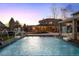 Backyard pool and patio area with basketball hoops and lounge seating, perfect for relaxing evenings at 14712 Kalamath Ct, Westminster, CO 80023