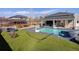 Backyard features a spacious pool, a built-in slide and lounge seating for outdoor enjoyment at 14712 Kalamath Ct, Westminster, CO 80023