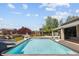 Inviting pool and well manicured yard with a slide and basketball hoops, perfect for summer fun at 14712 Kalamath Ct, Westminster, CO 80023