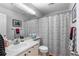 Functional bathroom with a shower, toilet, vanity and a mirrored wall at 19437 E Mann Creek Dr # A, Parker, CO 80134