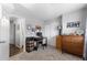 Cozy bedroom with neutral carpet and a home office setup at 19437 E Mann Creek Dr # A, Parker, CO 80134