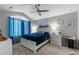 Bright bedroom with a large arched window, comfortable bed, and neutral decor at 19437 E Mann Creek Dr # A, Parker, CO 80134