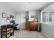 Bedroom with neutral walls and carpet, natural light from window, and furniture at 19437 E Mann Creek Dr # A, Parker, CO 80134