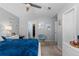 Bright bedroom with carpet, ceiling fan, and an open closet area at 19437 E Mann Creek Dr # A, Parker, CO 80134