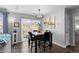 Cozy dining area with sliding glass door and decorative lighting fixture at 19437 E Mann Creek Dr # A, Parker, CO 80134